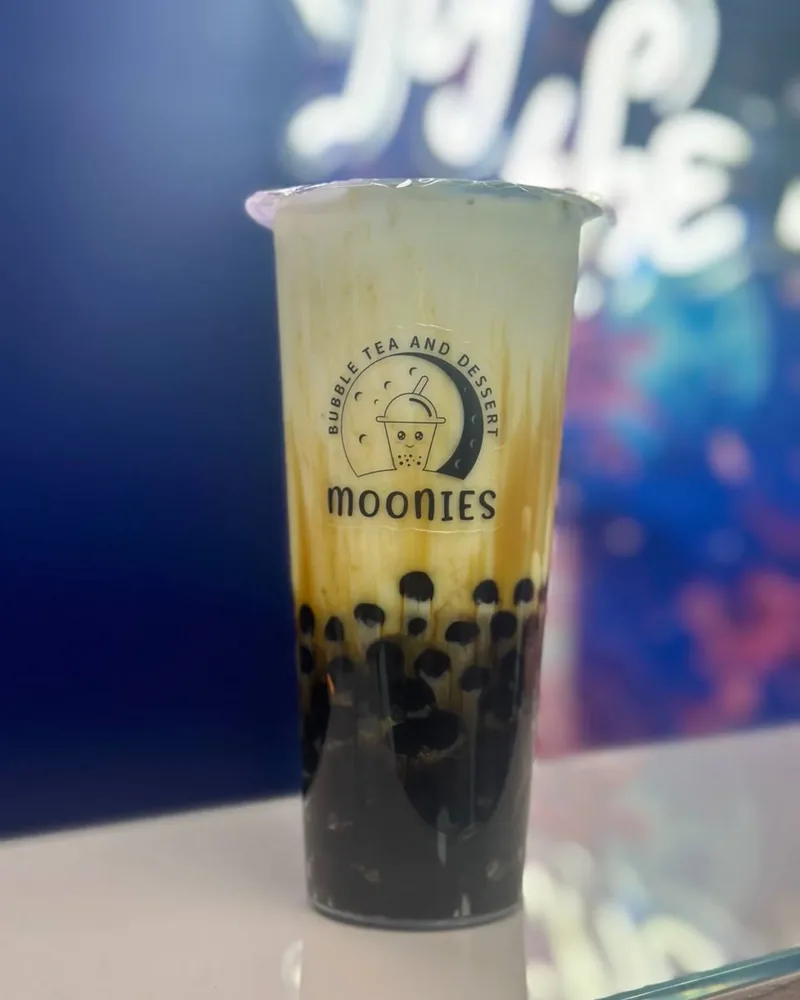 Close-up Moonies milk tea packed with black tapioca pearls